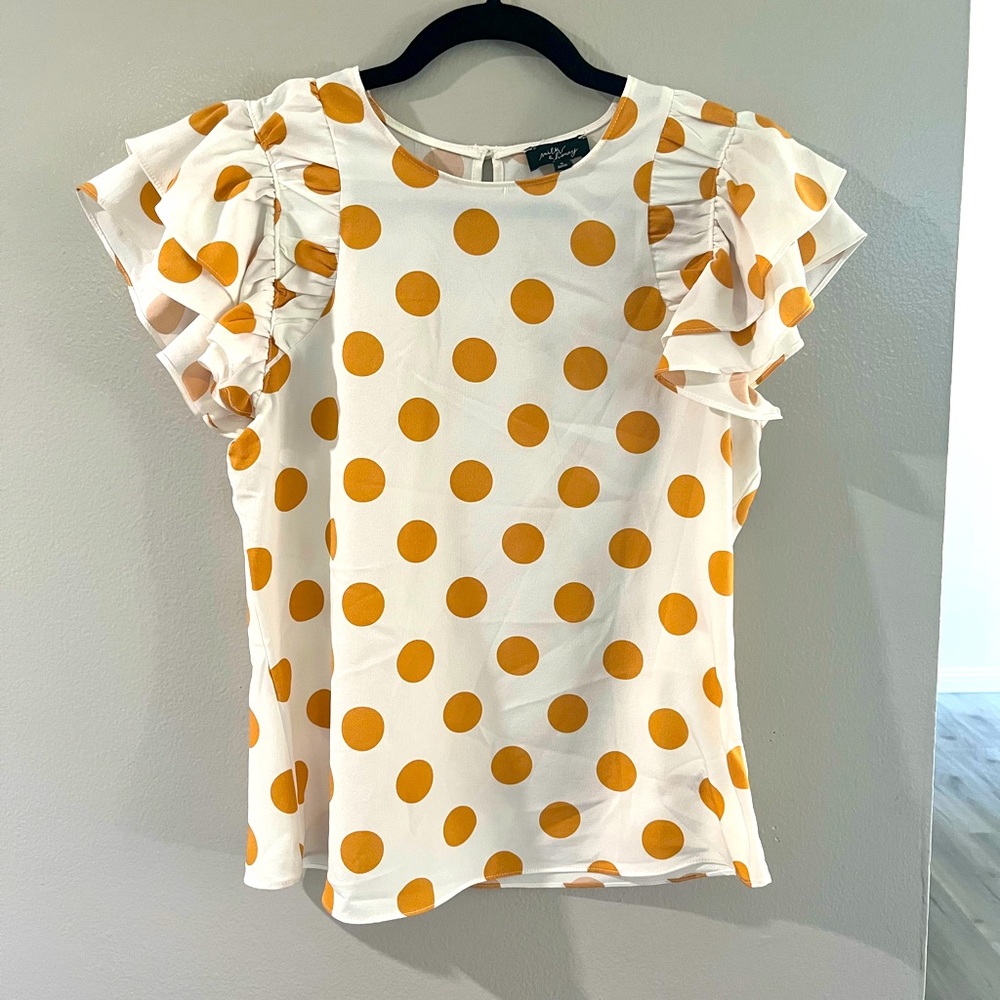 White and mustard blouse